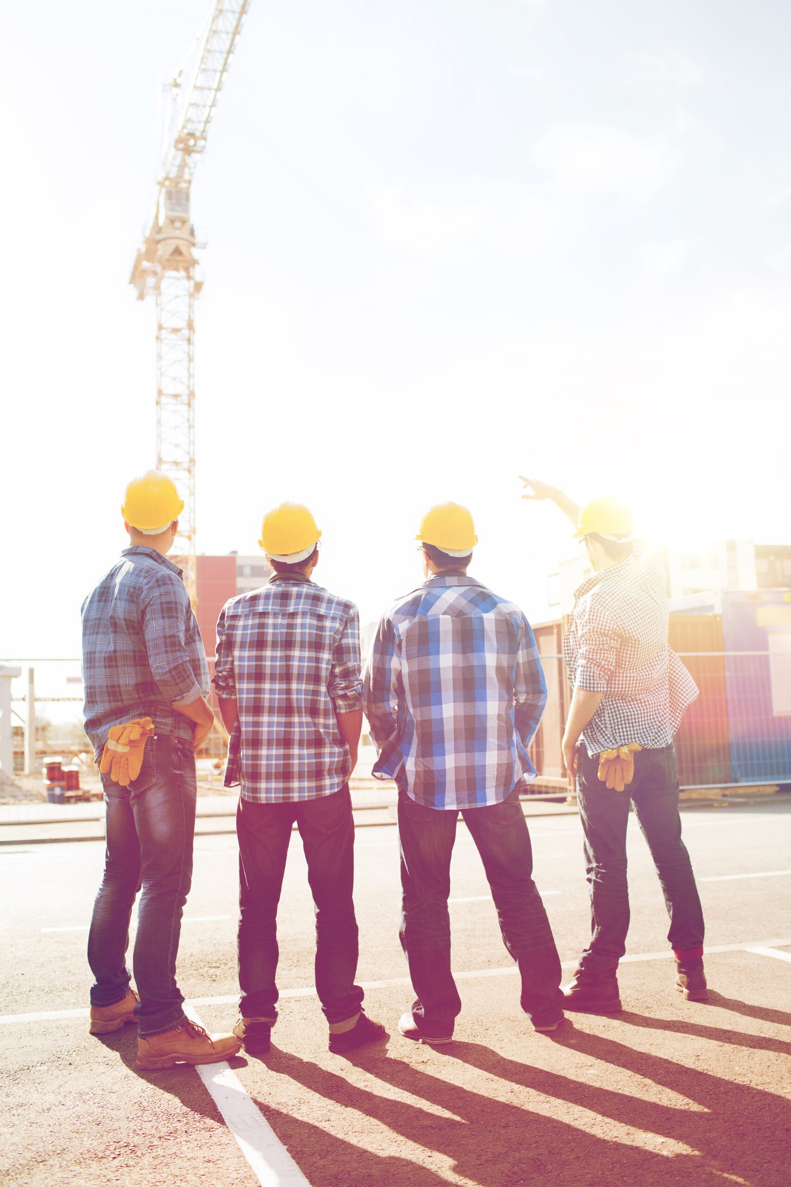 group of builders in hardhats outdoors